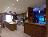 کابینت های چوبی و نورپردازی لایت آشپزخانه آپارتمان در ایزدشهر 4854168